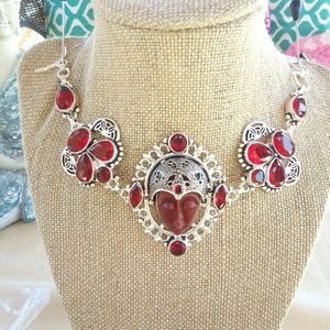 Garnets and Red Agate carved face bracelet.